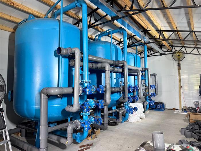 Filtration vessels and valves inside the treatment building.